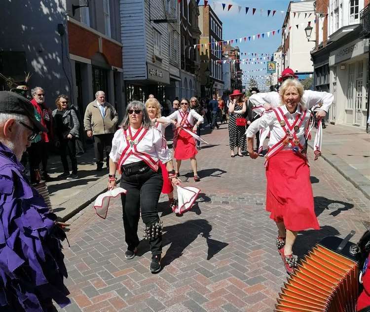 Morris dancers in action in Rochester High Street