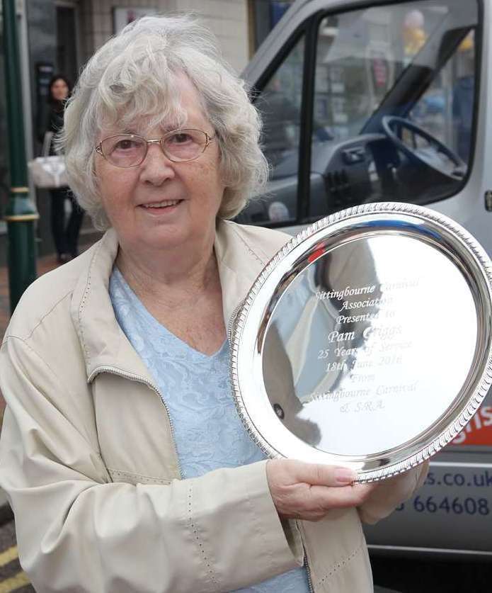 Pam with a shield marking 25 years of chairing the carnival association