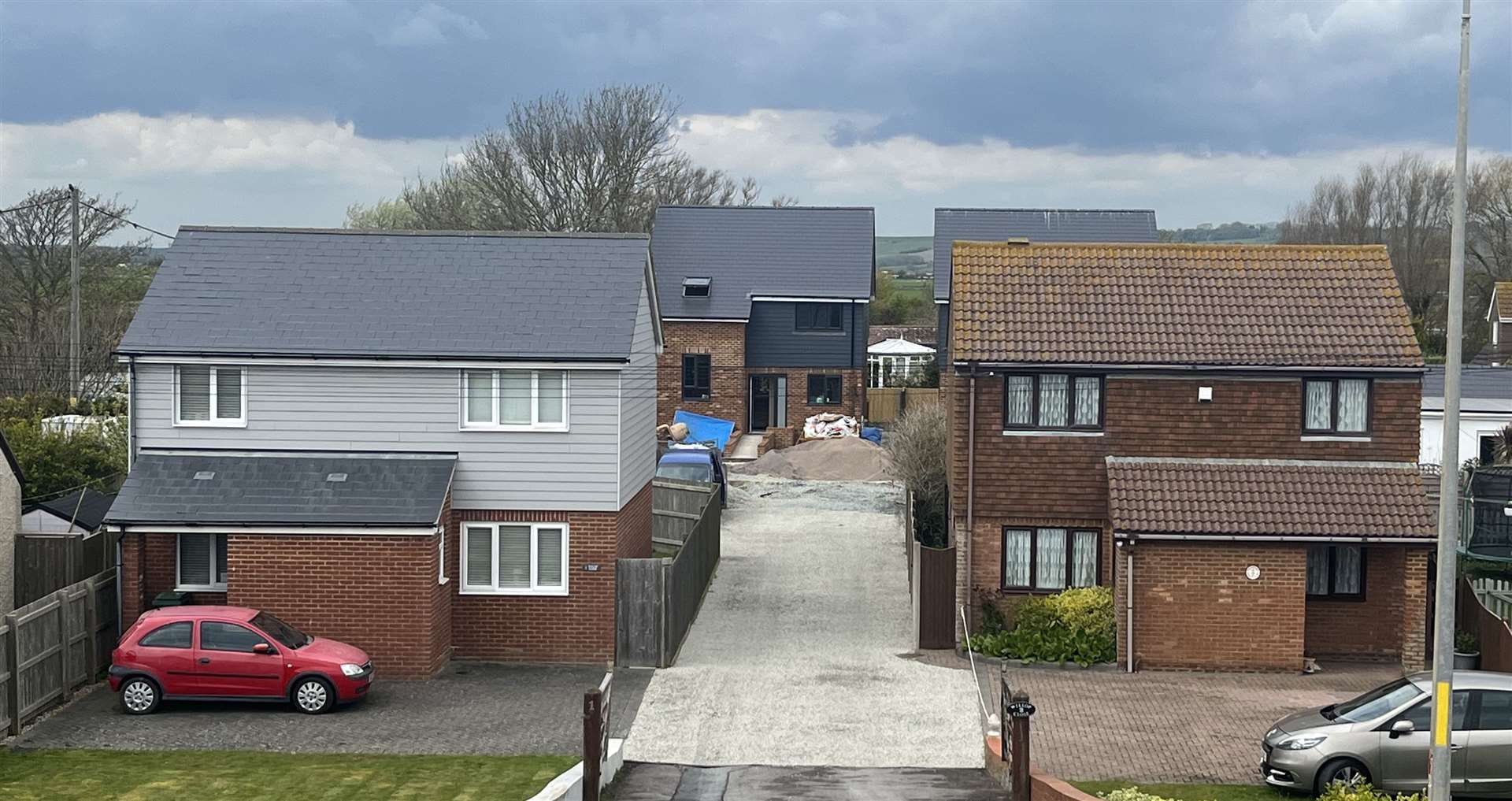 The two new homes - seen here behind the street-facing properties - have been built on land to the rear of Willop Close in Dymchurch