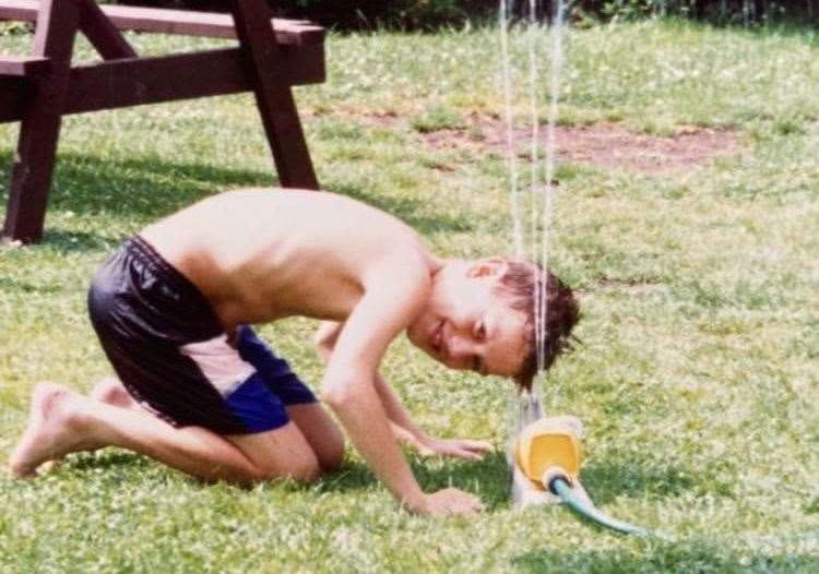 Gary Bush in the garden as a child