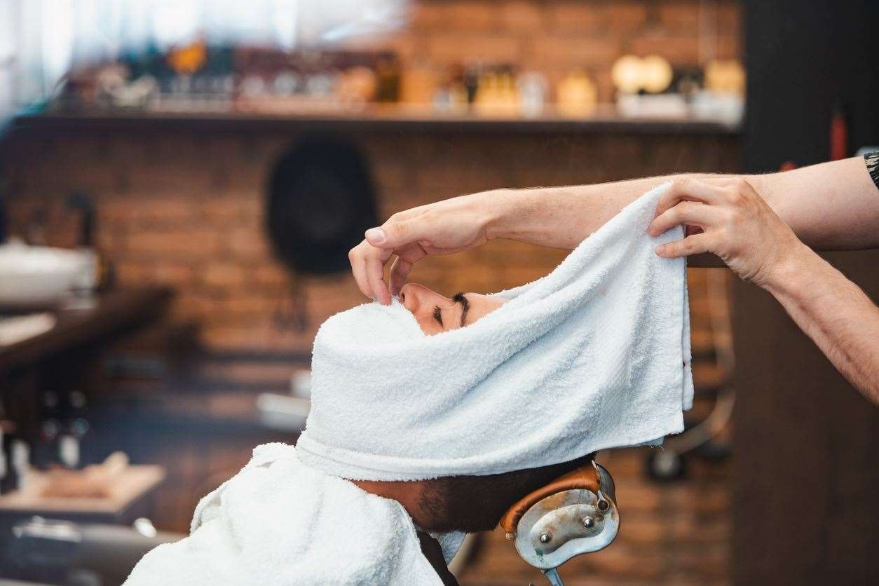 There will always be someone having a hot towel shave while you're waiting for a simple haircut, says Secret Thinker. Stock image