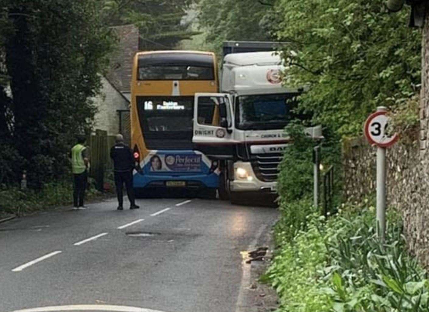 A bus and a lorry got wedged as they tried to pass each other on a narrow stretch of the A260 Canterbury Road