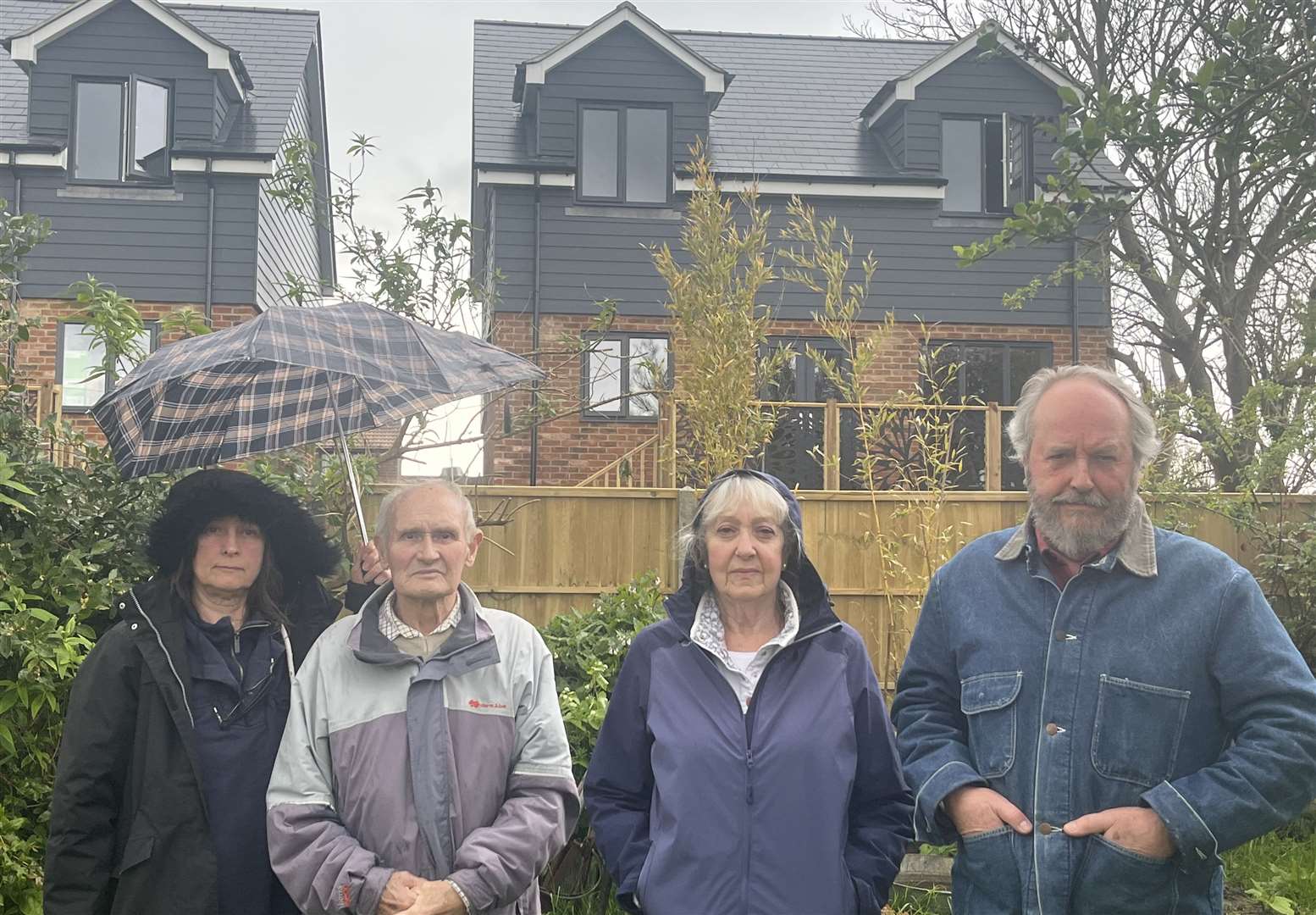 John Field, Maureen Field and Peter Johnson are some of the residents of Hythe Road, Dymchurch, angry about the new-builds behind their gardens