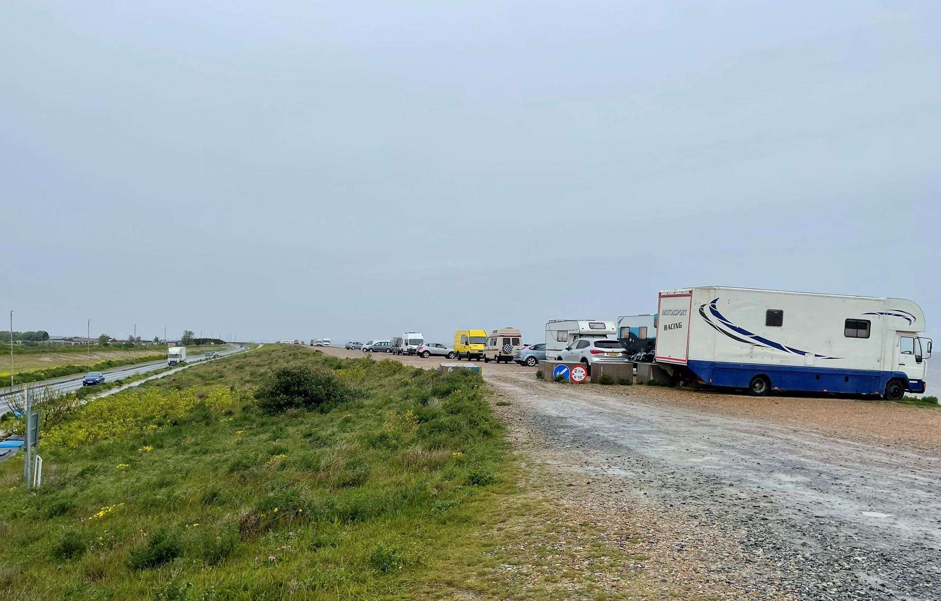 A row of caravans, camper vans and cars parked up on the Shingle Bank in Minster. Picture: Joe Crossley