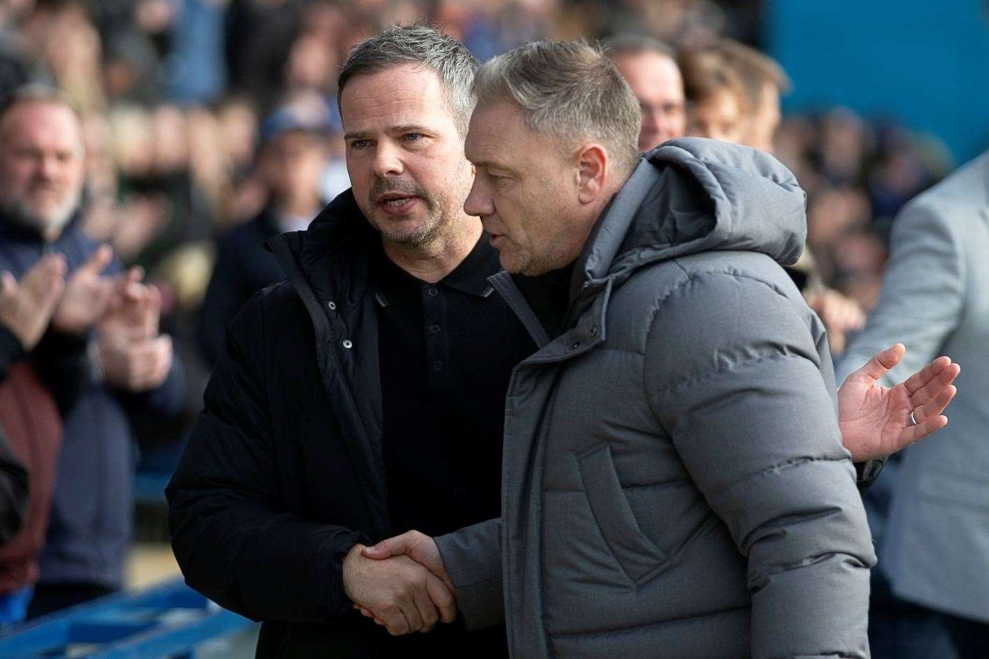 Stephen Clemence shakes hands with Scott Lindsey when Gillingham met Crawley Town earlier this season Picture: @Julian_KPI