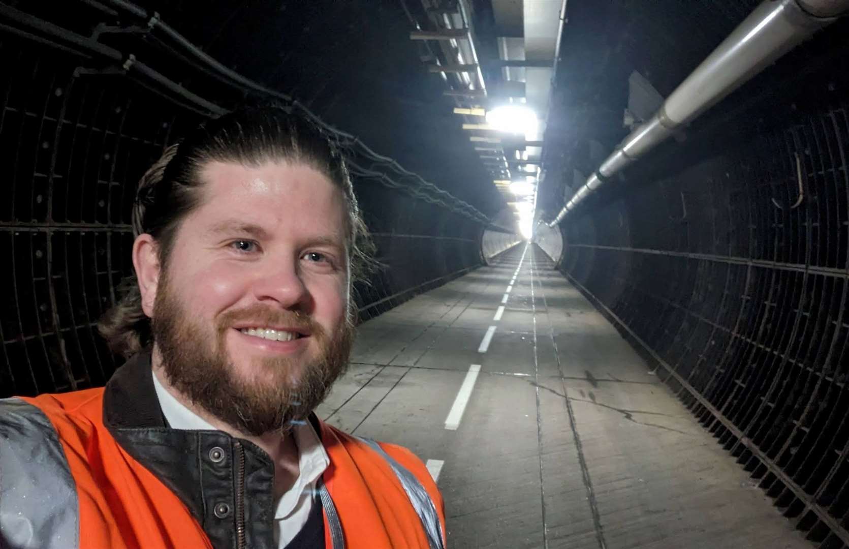 Reporter Rhys Griffiths inside the Channel Tunnel service tunnel under Samphire Hoe during a site visit in April