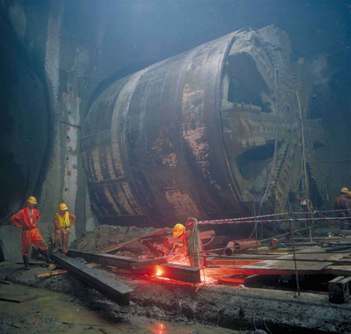 Engineers and a tunnel boring machine pictured during the construction of the Channel Tunnel. Picture: Getlink