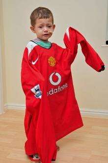 Oliver Smith with the Wayne Rooney shirt donated to raise money for his appeal