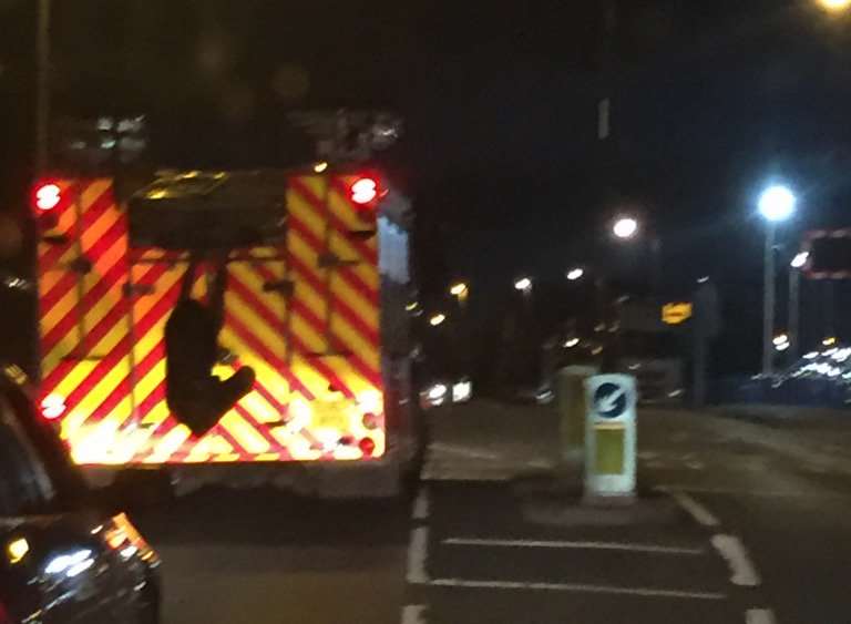The picture appears to show a man hanging off the back of a fire engine. Picture: Tony Scott