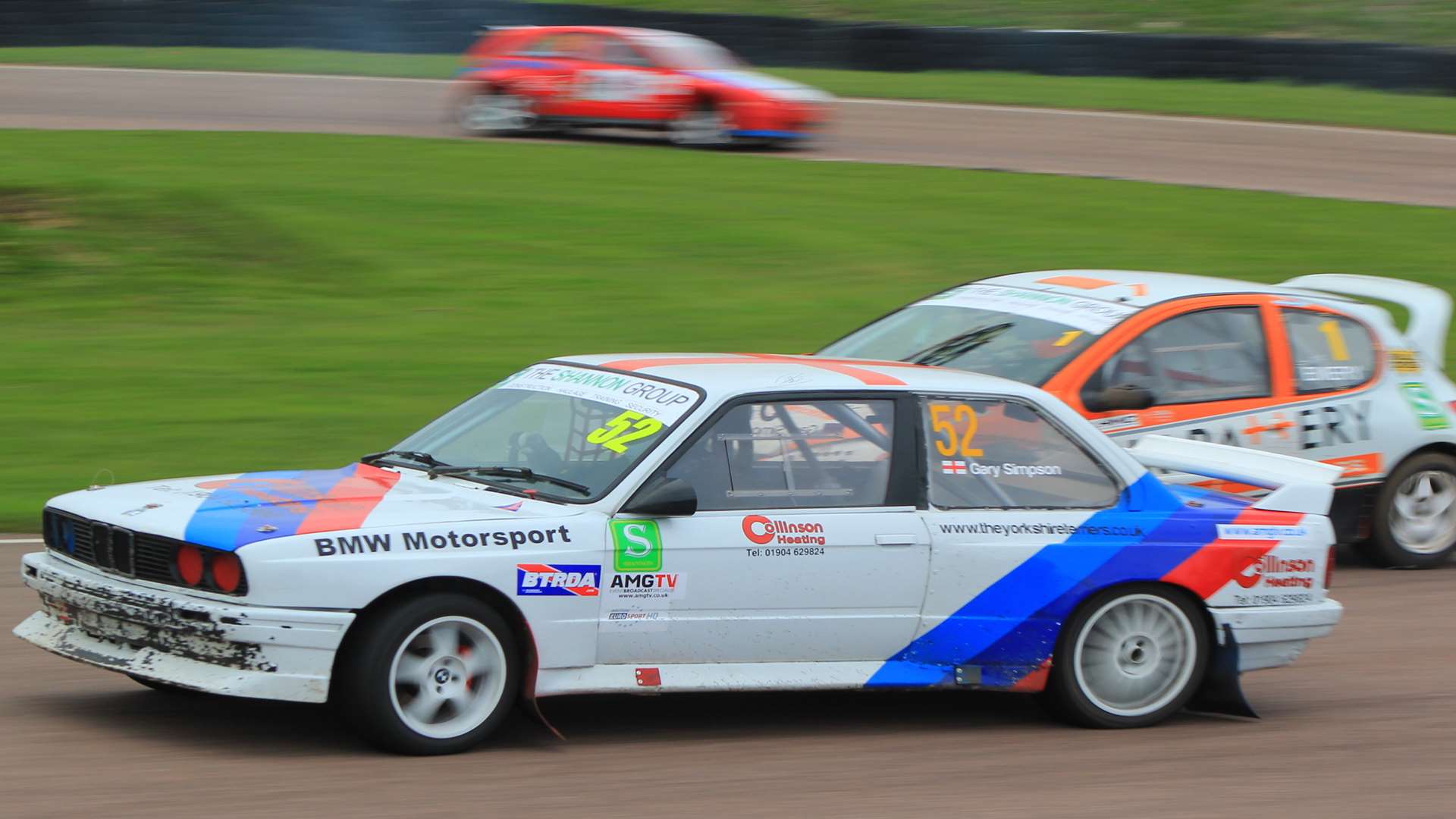Gary Simpson slides his BMW ahead of Stuart Emery and Allan Tapscott in SuperNational. Picture: Joe Wright