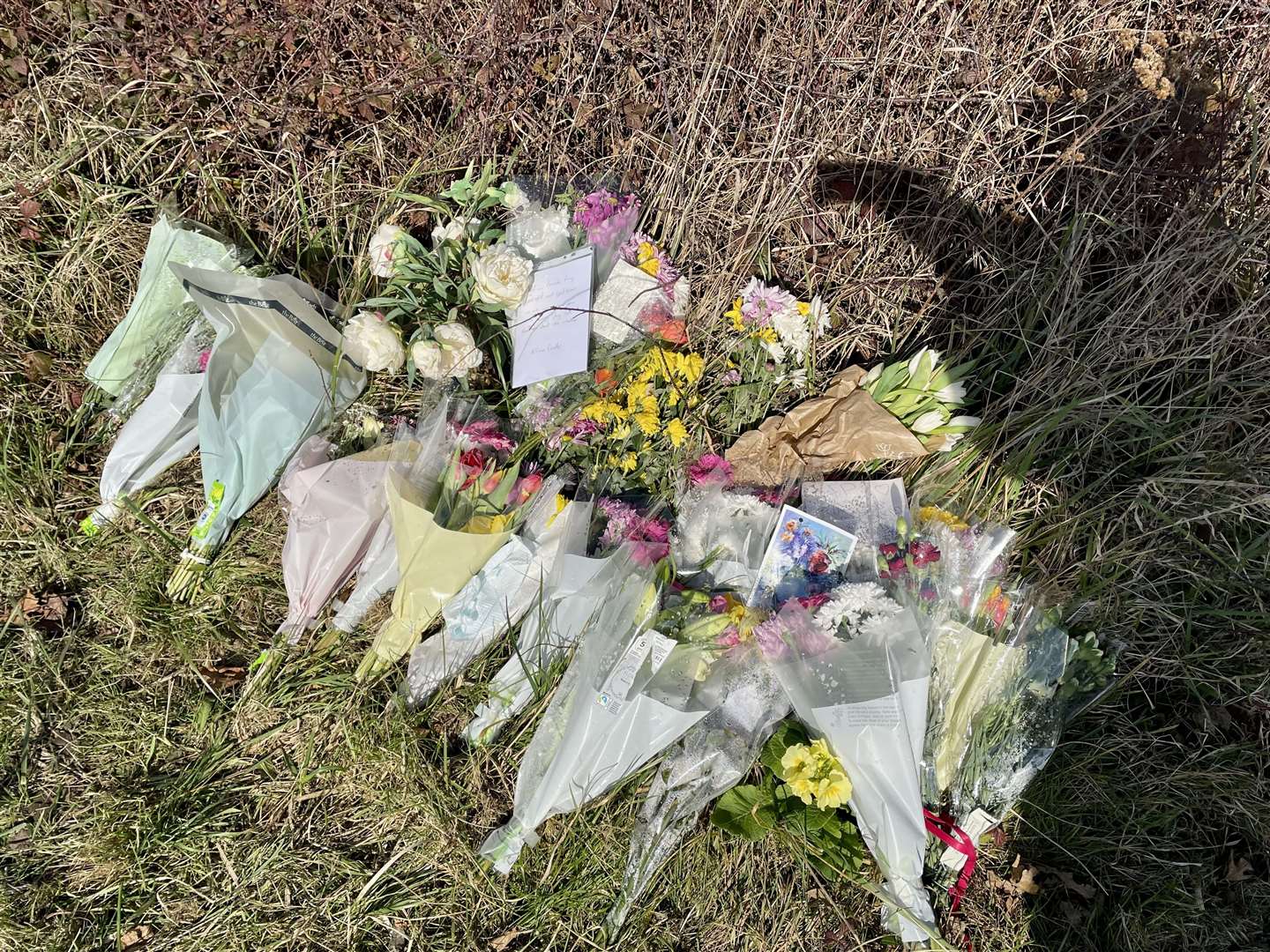 Up to 20 bunches of flowers have been laid along the A257