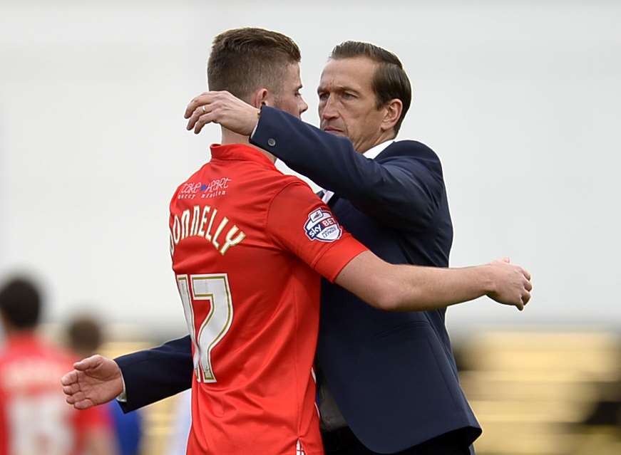 Gills boss Justin Edinburgh with Rory Donnelly after the final whistle at Chesterfield. Picture: Barry Goodwin