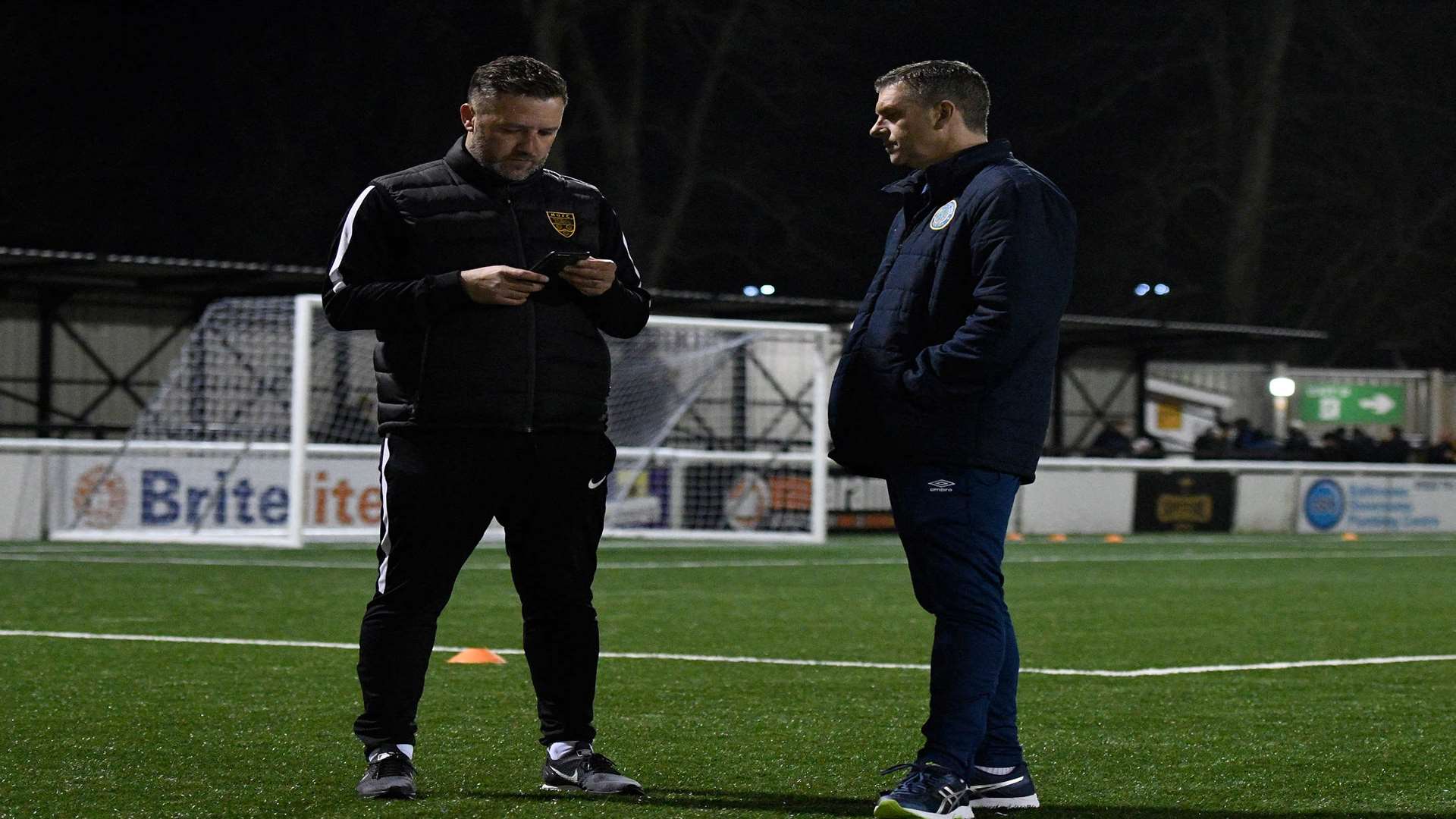 Maidstone boss Jay Saunders with Macclesfield manager John Askey Picture: Andy Payton