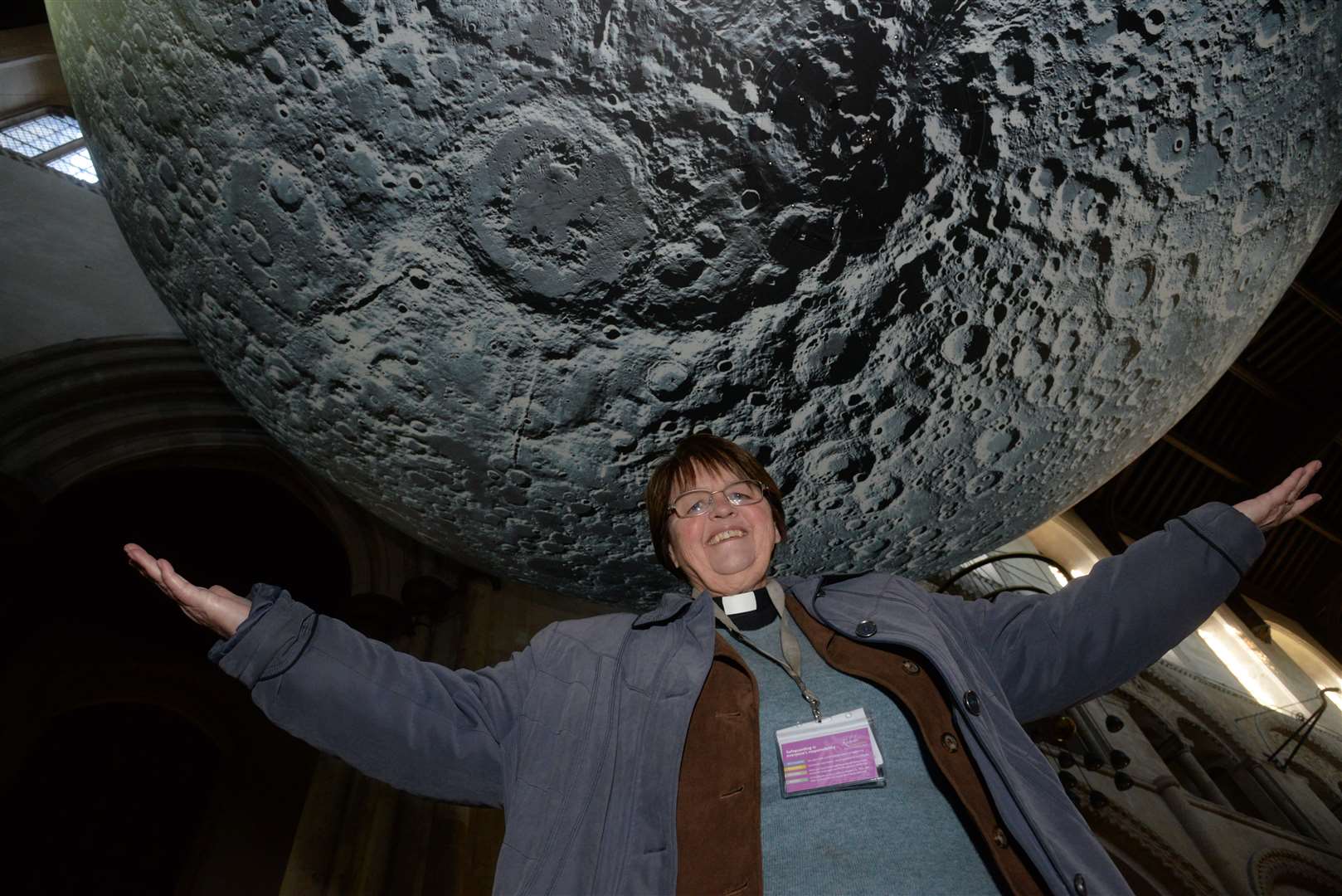 Canon Sue Brewer with the Moon on the first day of the Museum of the Moon exhibition in Rochester Cathedral
