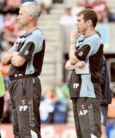 Alan Pardew and Phil Parkinson are pictured wearing each others tracksuit bottoms at Preston. Now Parkinson will be filling his former boss' shoes at QPR tomorrow. PICTURE: BARRY GOODWIN