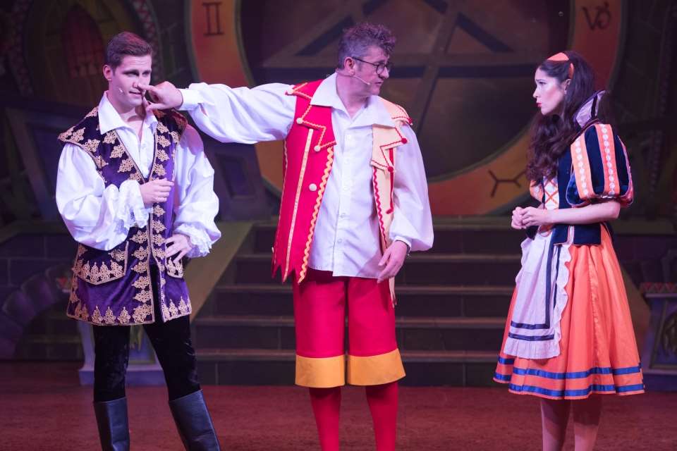 Joe Pasquale as Muddles tries to keep Prince Calum of Kent (Alexis Gerred) and Snow White (Victoira Serra) apart at Dartford's Orchard Theatre