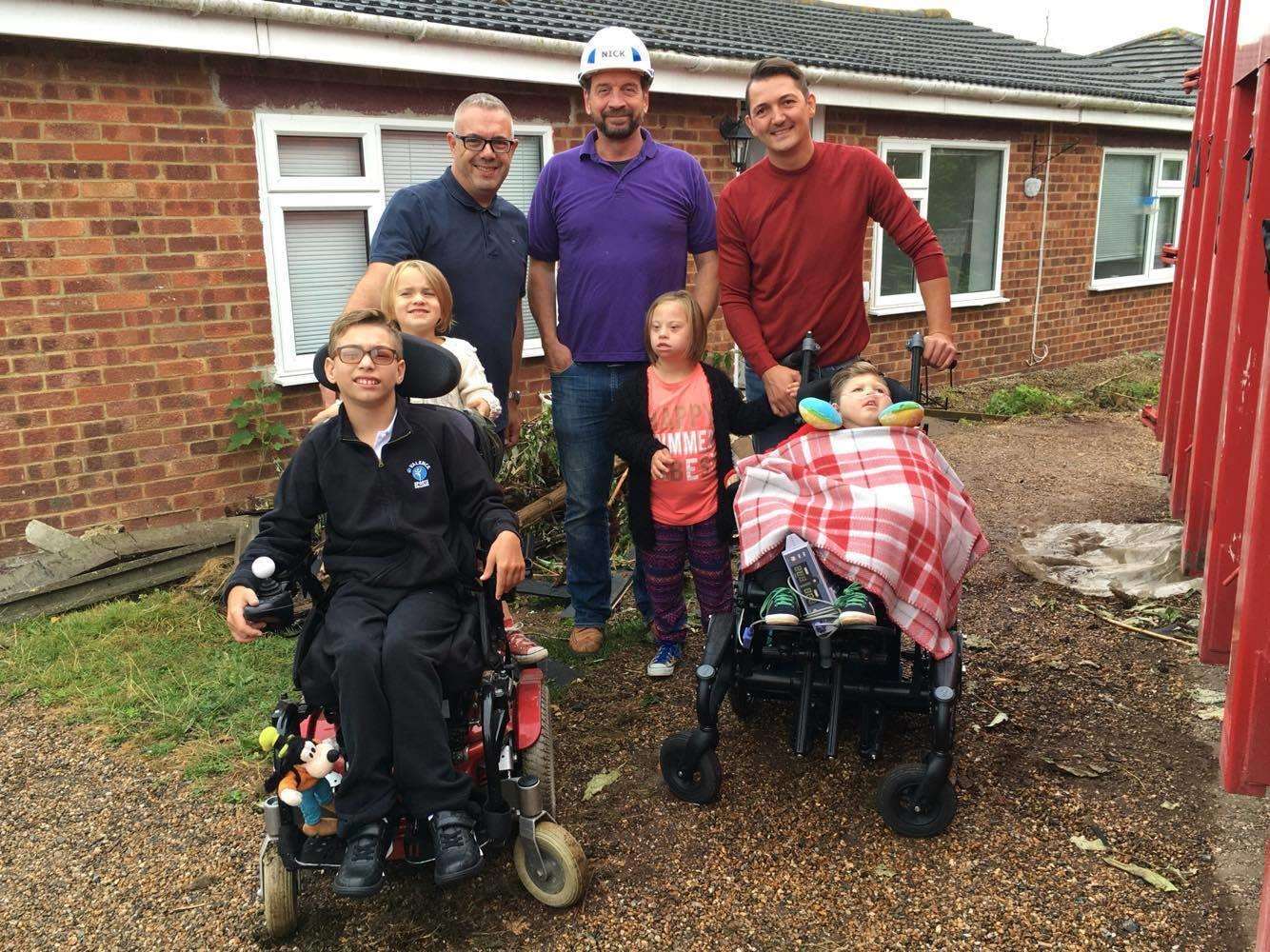 Nick Knowles with the Ratcliffe family before the DIY SOS rebuilt their Sheppey bungalow