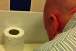 Neil Rix leans over a toilet before snorting a substance