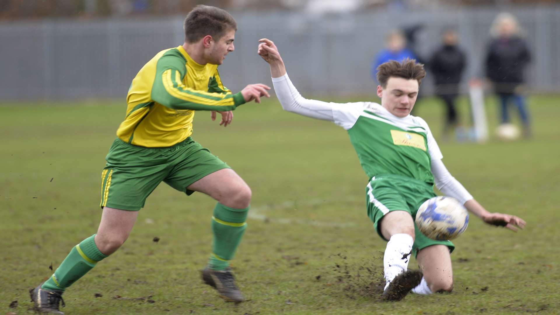 Horsted Youth under-18s (green and white) slide in against Cliffe Woods Colts Athletic Picture: Ruth Cuerden