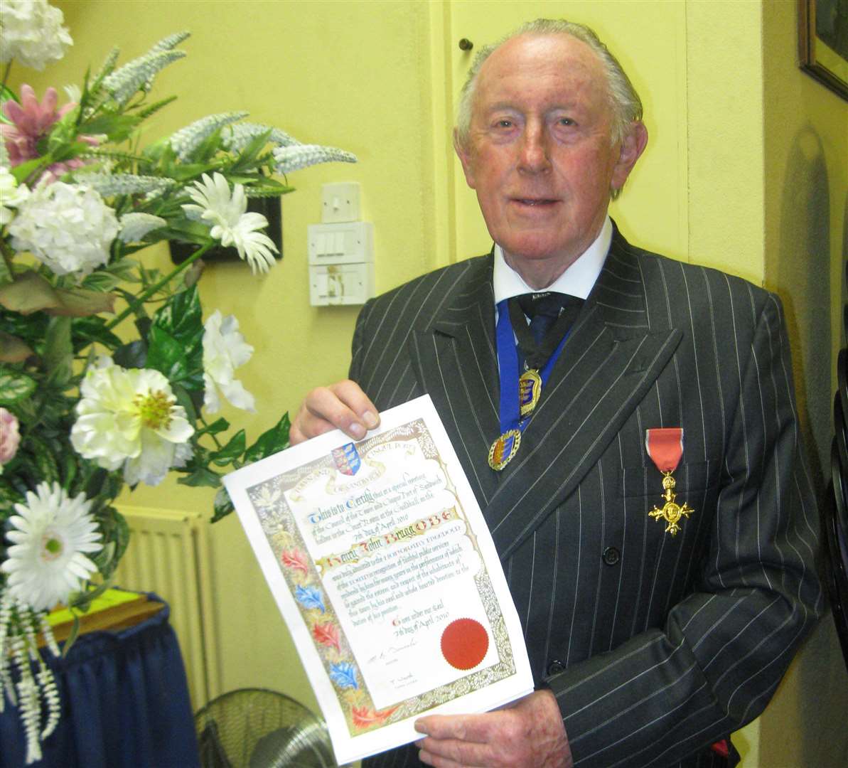 John Bragg with the freeman scroll he received in 2010