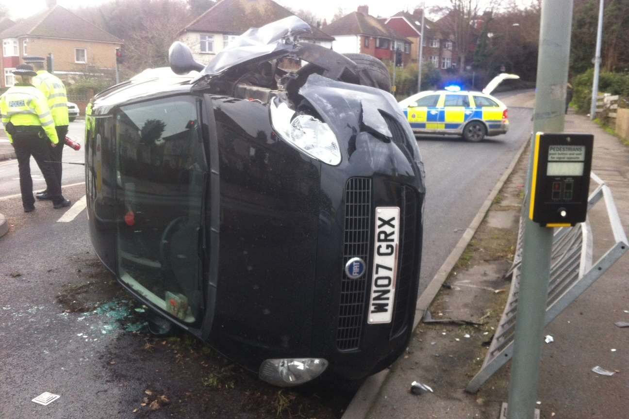 The car on its side in Old Road East