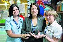 Anne-Marie Harman, Joanne Barton and Daphne Chapman with the trophy awarded to Fledgelings Nursery in Ramsgate