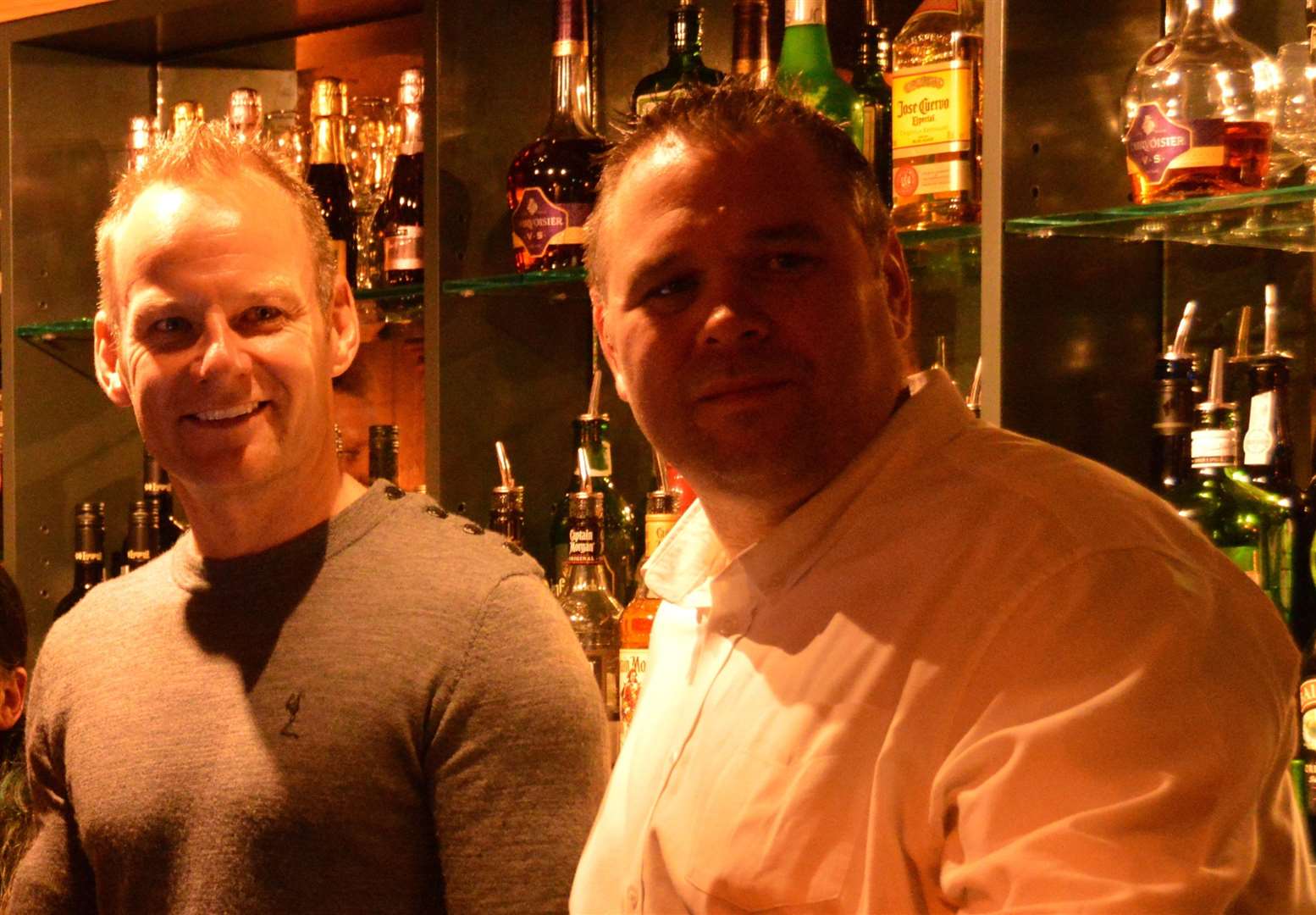 Landlord Stuart George, right, with motorbike racing star Shane 'Shakey' Byrne behind the bar at the Dover Castle in 2017