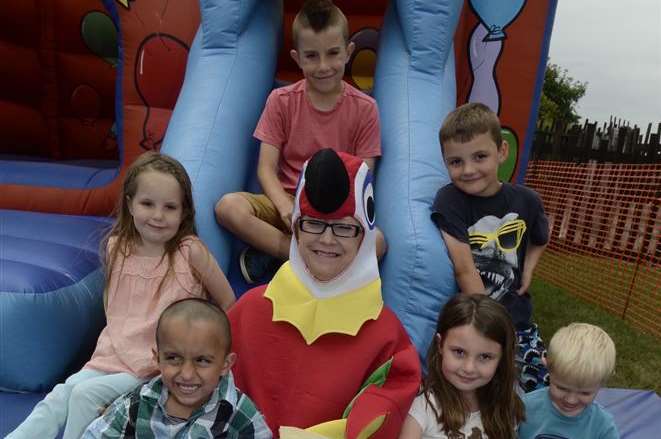 Tracey Chaplin with children on the bouncy castle