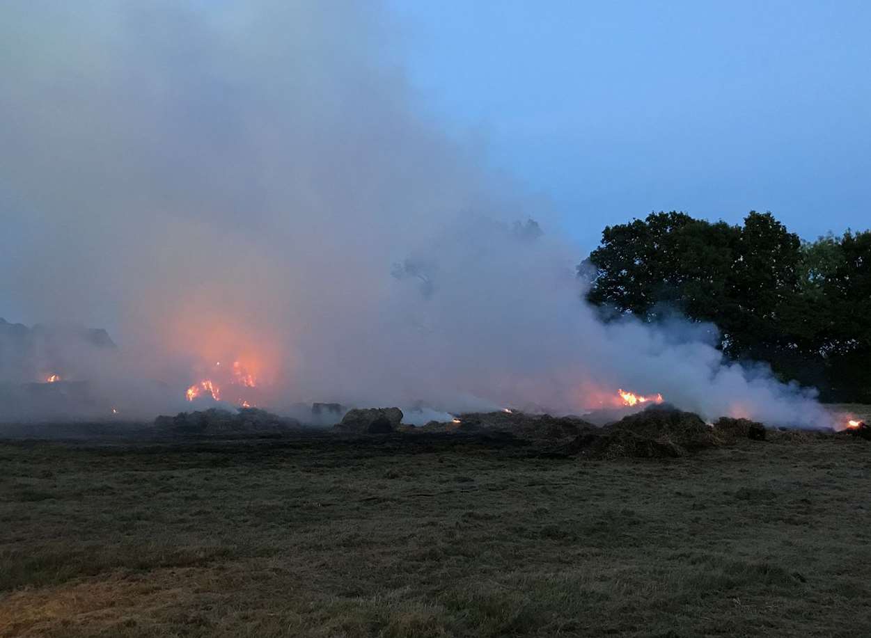 Fire crews were called to farmland off Goudhurst Lane in Marden after 100 bales of hay caught fire. Picture: Anita Wilson