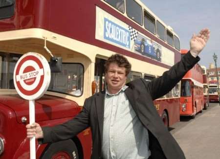 Chris Stone, flagging a bus down