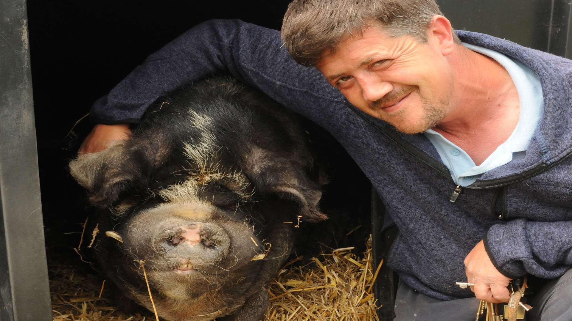 Andy Cowell with Spice the Kune Kune pig