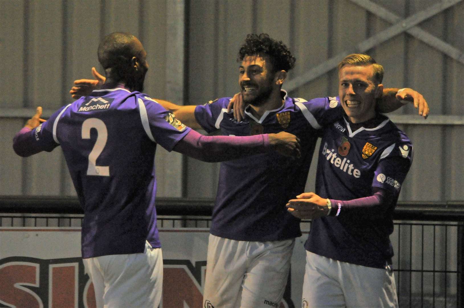 Gavin Hoyte celebrates with George Porter and Sam Corne after laying on the winner at Slough Picture: Steve Terrell