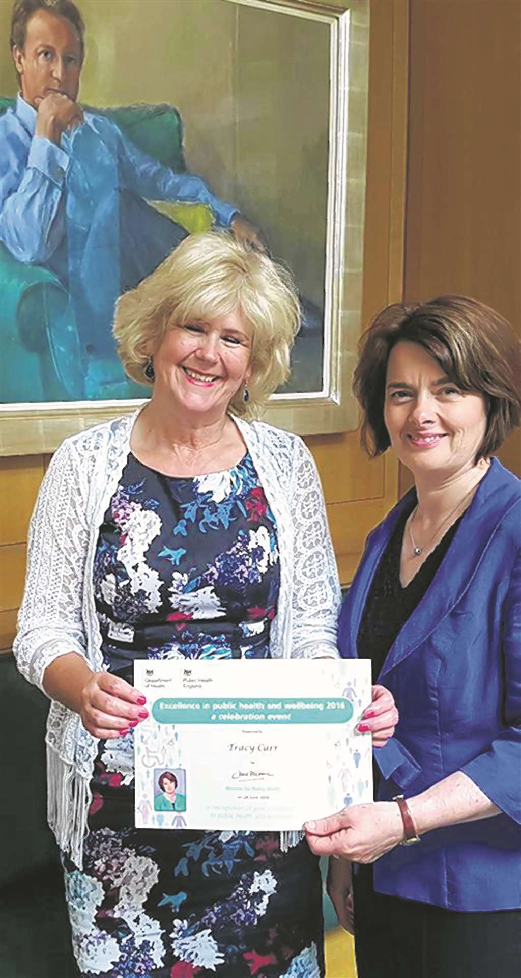 Tracy Carr collects her certificate from Secretary of State for public health Jane Ellison