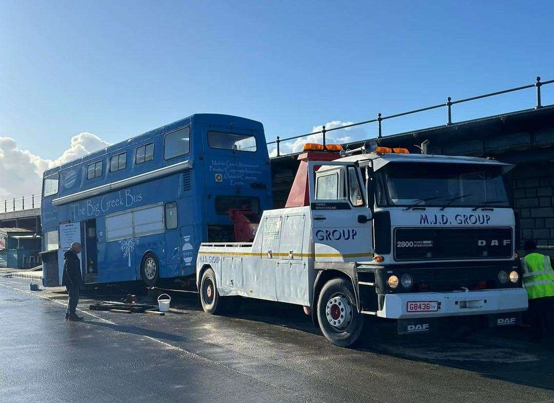It's the end of an era as The Big Greek bus is towed away from Folkestone Harbour Arm. Picture: Lee Daniels