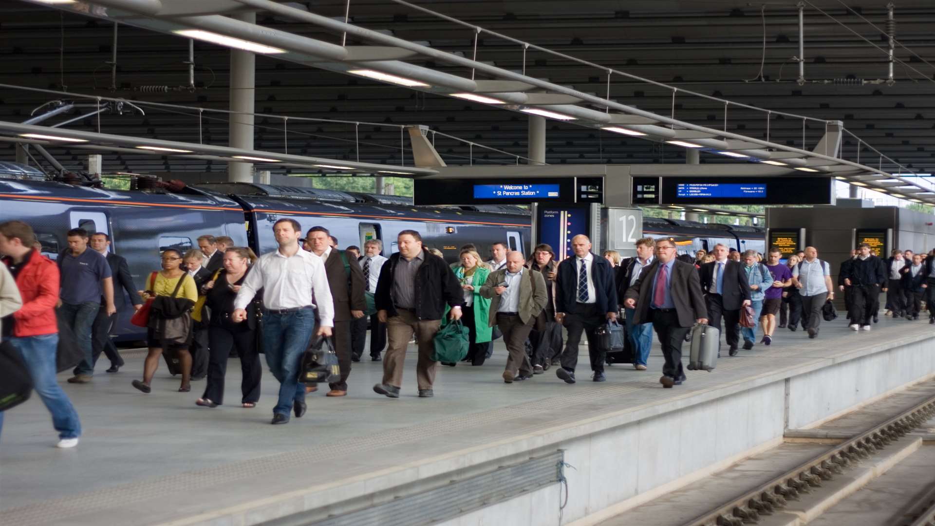Passengers flood onto St Pancras station after the arrival of the high speed train