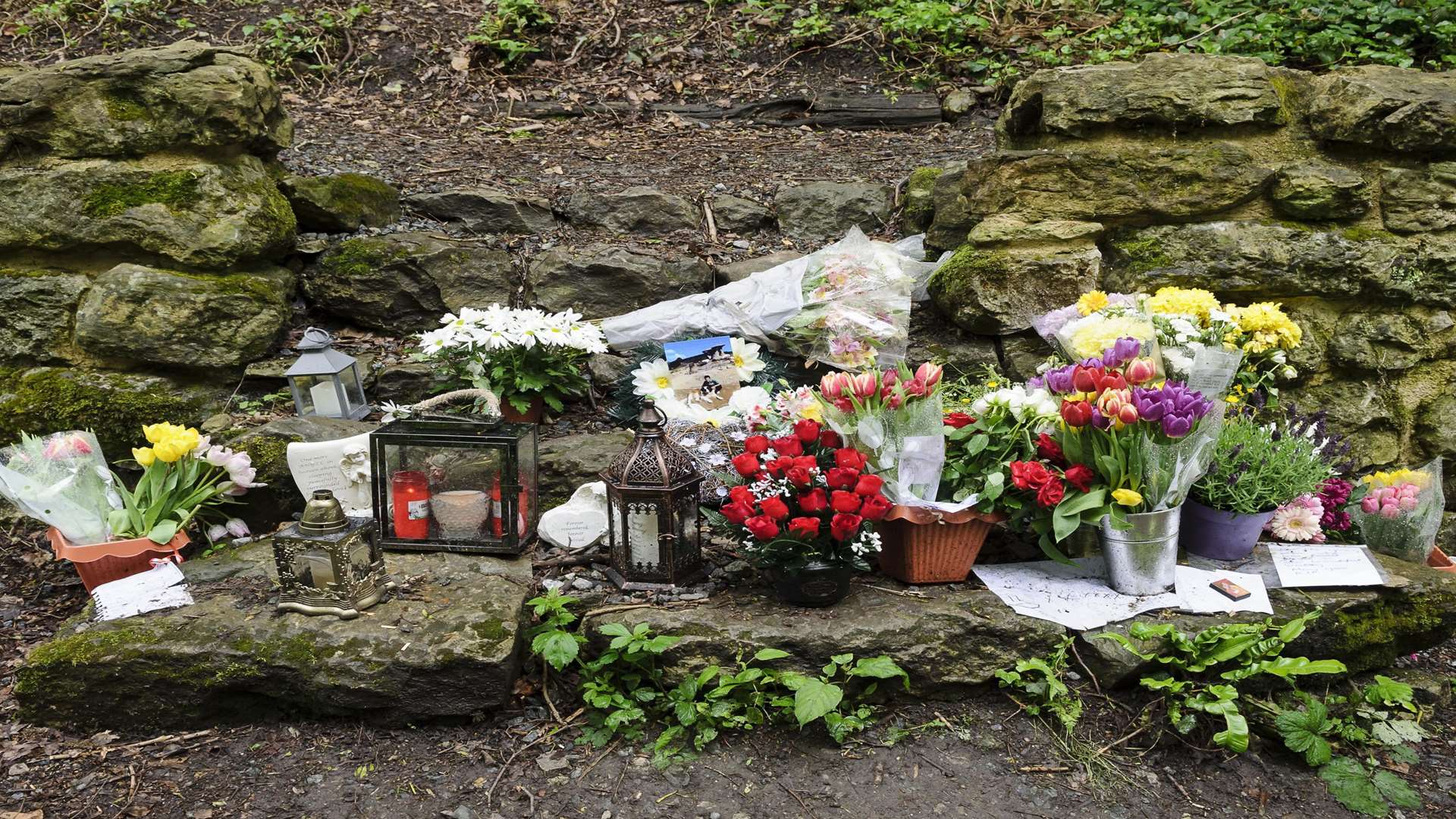 Flowers, lanterns and other items were left in tribute to 21-year-old Razvan Sirbu
