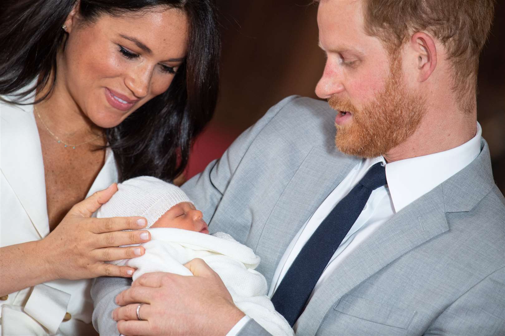 The Duke and Duchess of Sussex with their baby son Archie Harrison Mountbatten-Windsor, who was born on Monday morning, during a photocall in St George's Hall at Windsor Castle in Berkshire. Pic Dominic Lipinski PA