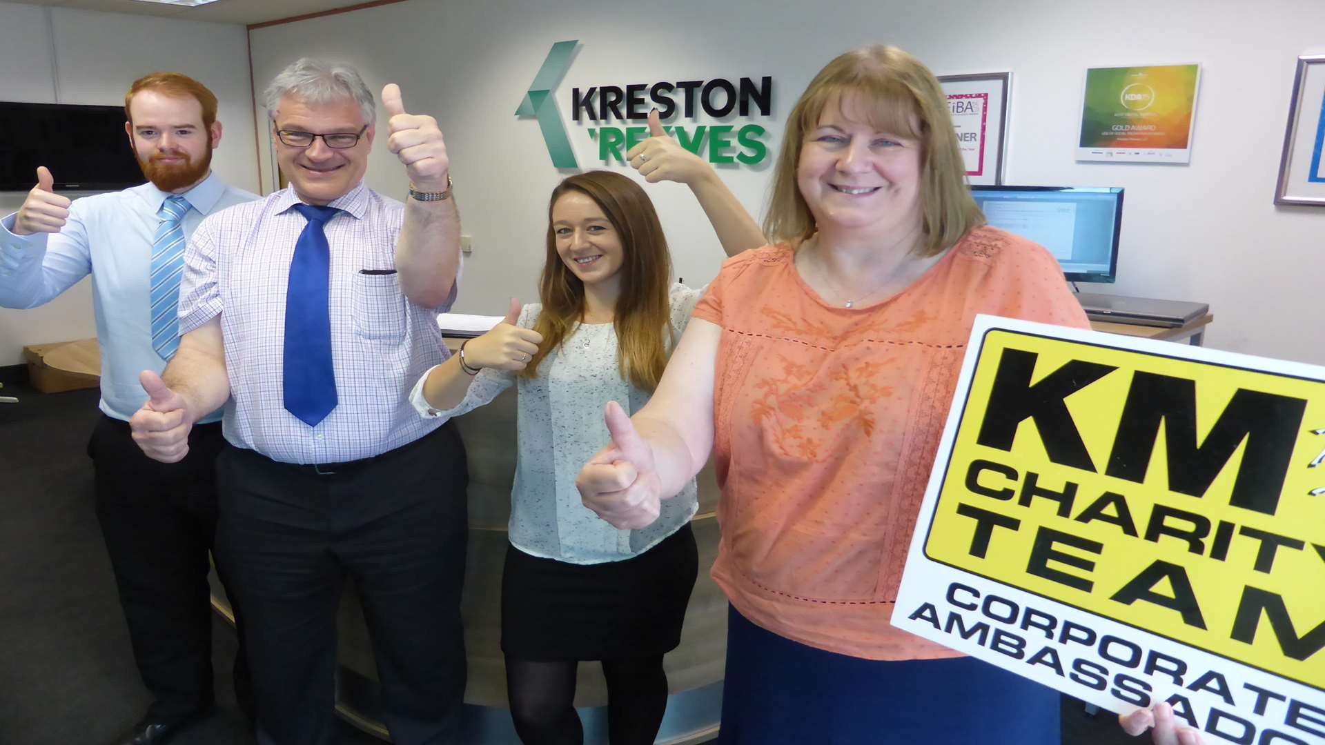 Susan Robinson and the Kreston Reeves team celebrate being named Corporate Ambassadors of the KM Charity Team following their support of the charity's annual Forum.
