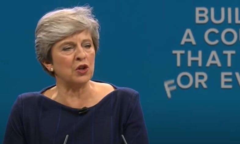 Letters fall down behind Theresa May during her Tory party conference speech in 2017