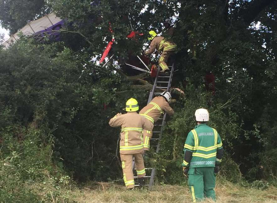 Emergency services worked together to free the pilot. Picture: SECAmbHart