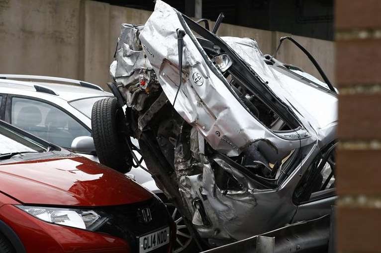 The wreckage of the car that somersaulted from the A20 roundabout onto the Megger multi-storey car park