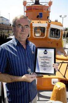 Andy Willmore with his statuette and certificate on board Sheerness all-weather lifeboat