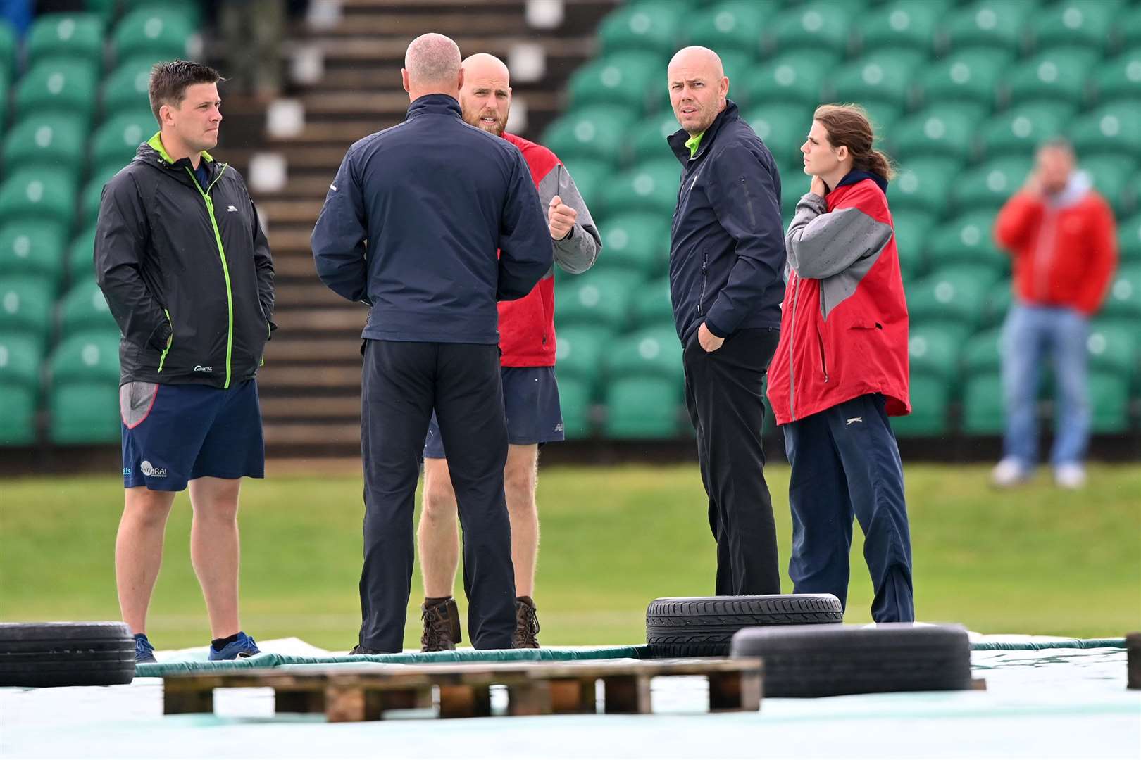 The umpires inspect the ground before working out when play could get under way. Picture: Keith Gillard (50010096)