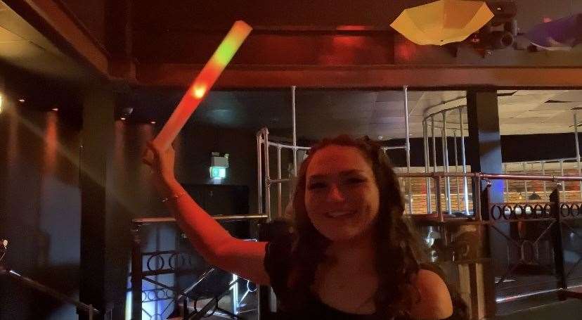 To grab the bar staffs attention you wave a light up foam stick in the air
