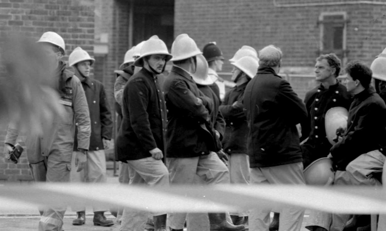 Firefighters outside the barracks on the day of the bombing