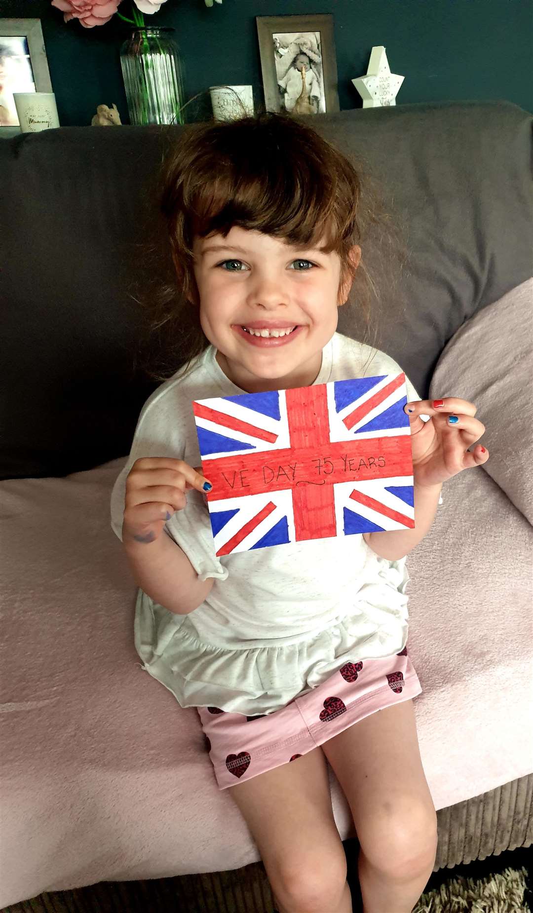 Maddison Woodfine, 5, from Maidstone with her homemade VE Day flag