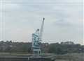 Man climbs to top of crane