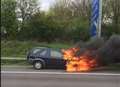 Firefighters tackle car blaze on M20