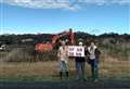 Protest at site of controversial housing scheme