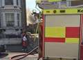 Road closure as fire tears through derelict building
